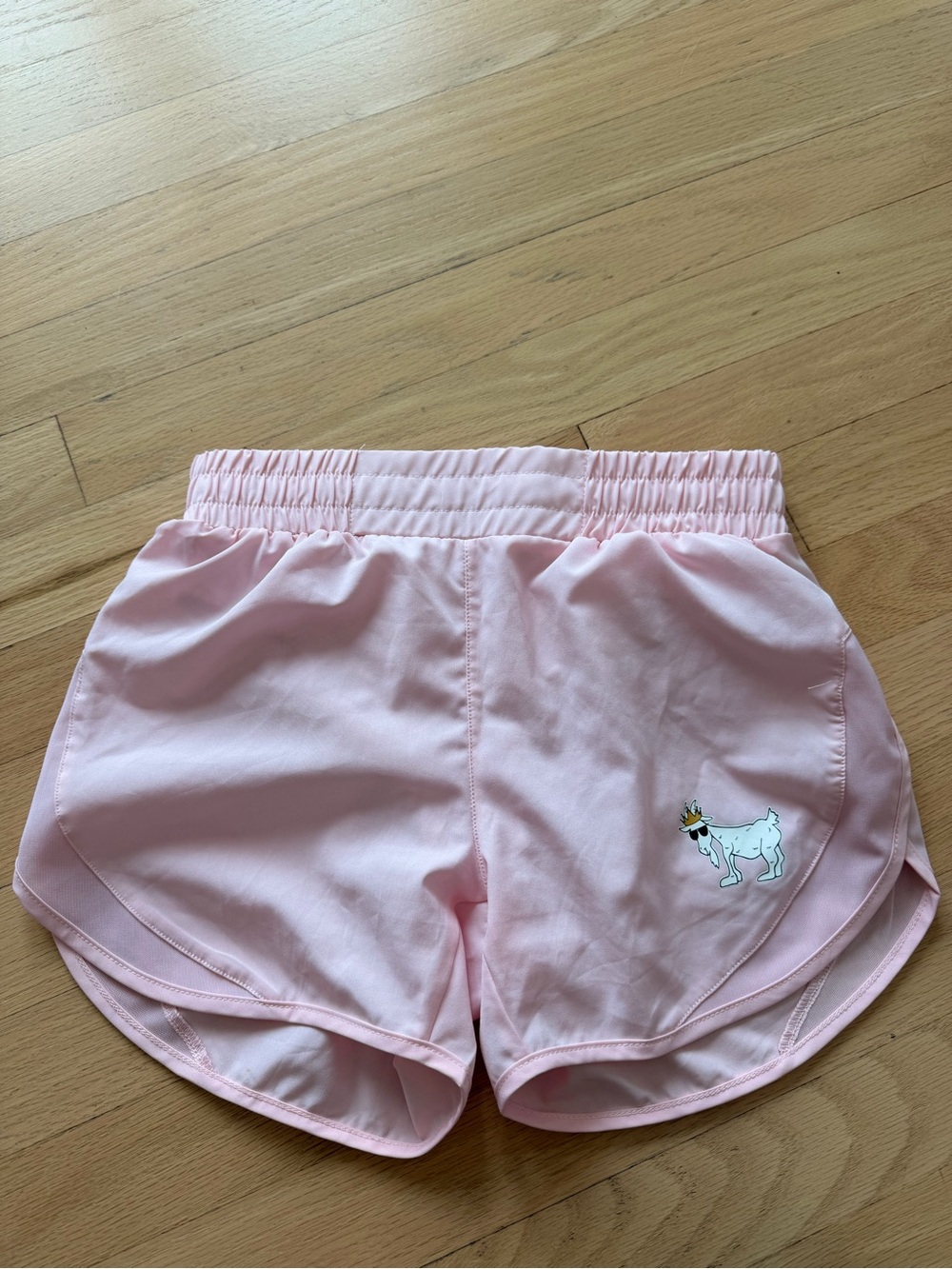 Women's Light Pink Athletic Shorts with Playful Dog Accent